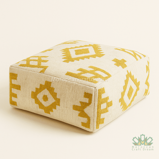 Beige ottoman with yellow geometric patterns on a white background