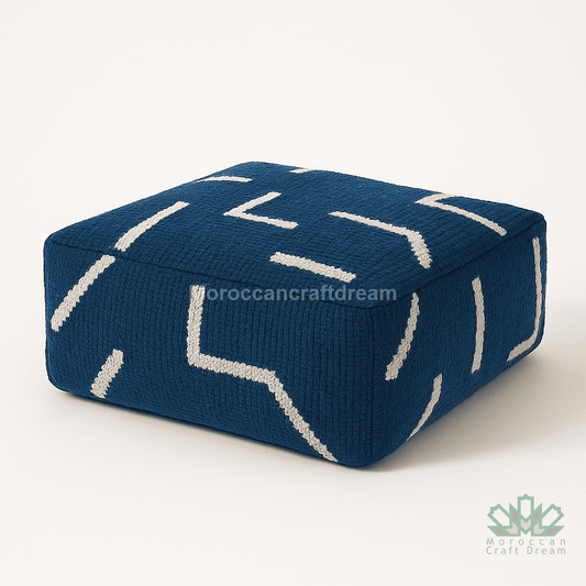 Blue cushion with white patterns on a white background
