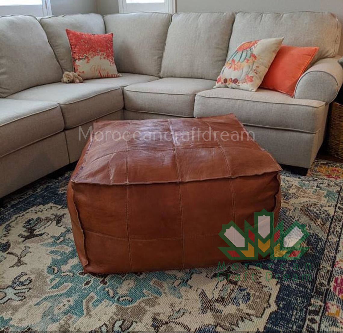 Tan Square large leather ottoman coffee table, a versatile decor piece that suits contemporary and traditional styles.