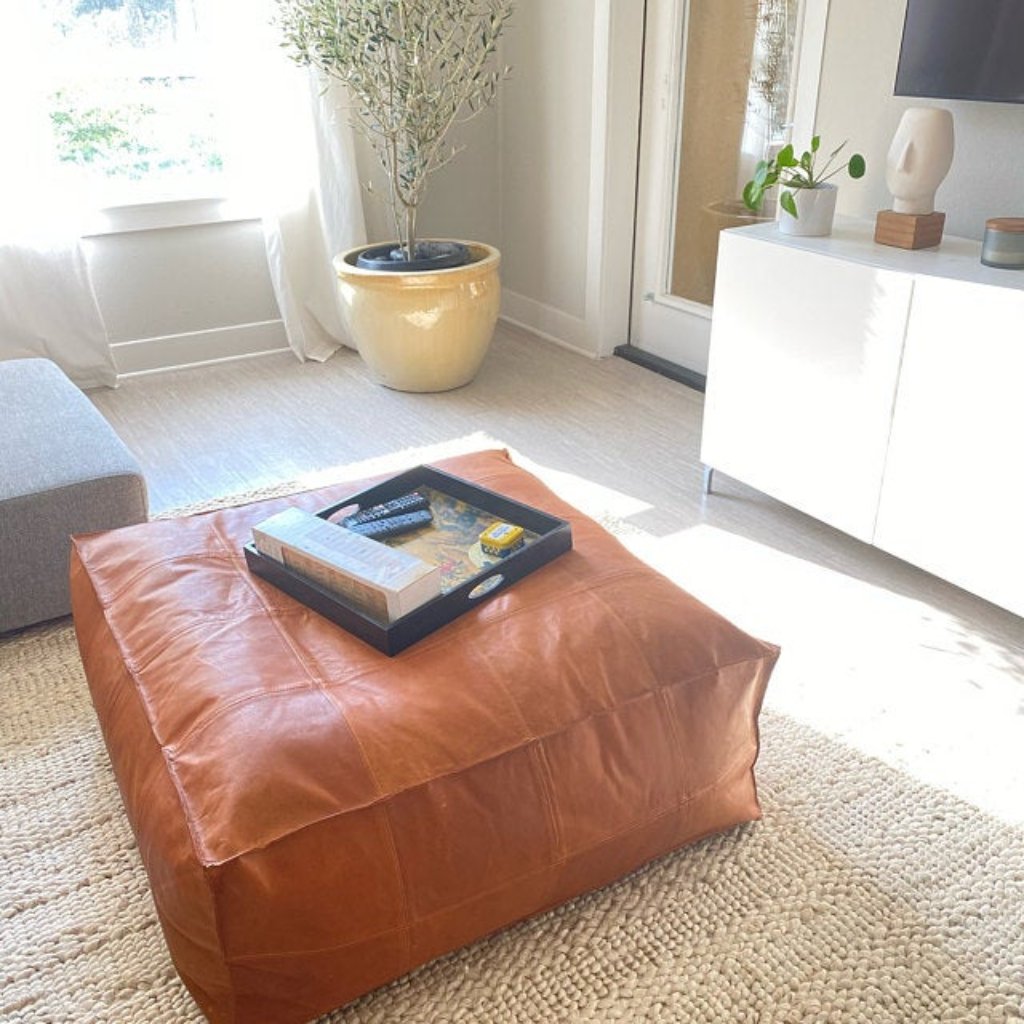 Large tan Classic leather ottoman coffee table, a modern addition that combines elegance and functionality.