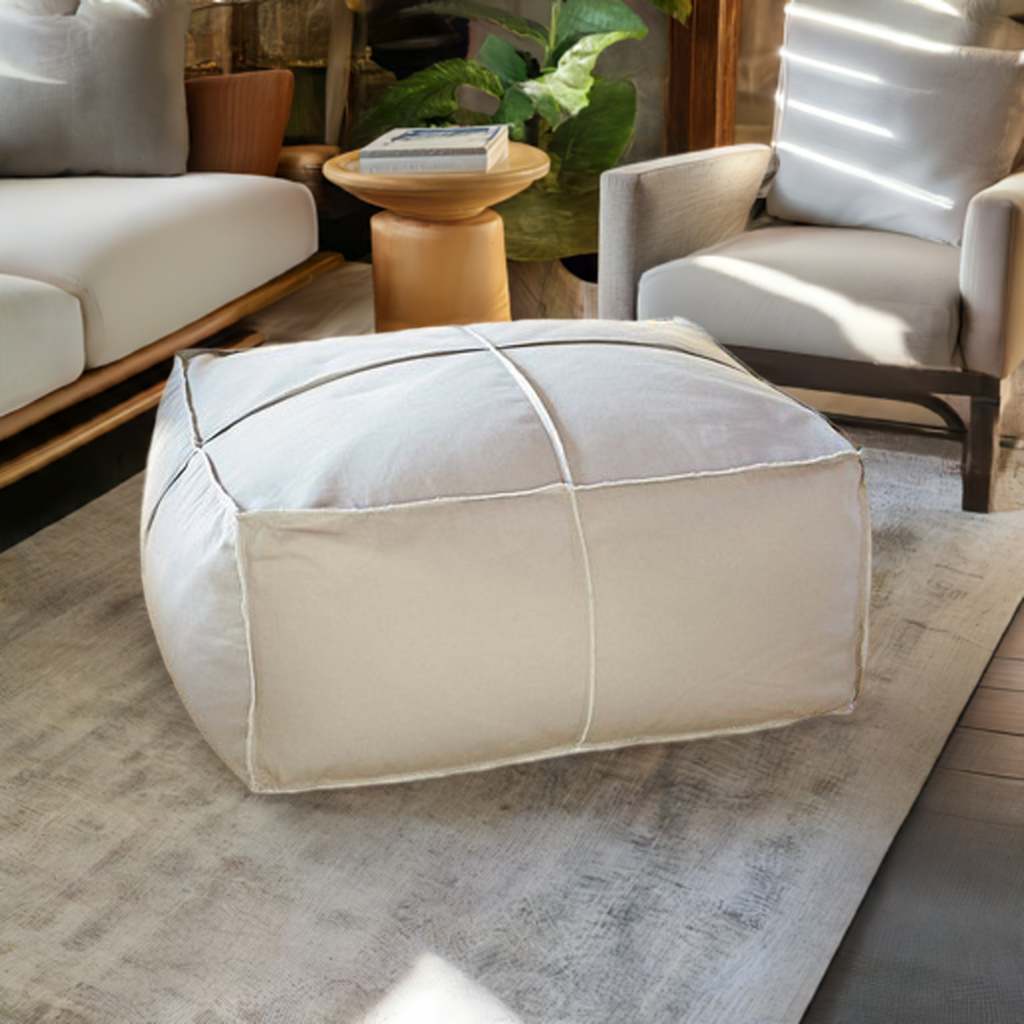 Large white large pouf Square leather coffee table ottoman, crafted for both aesthetics and practicality in living room decor.