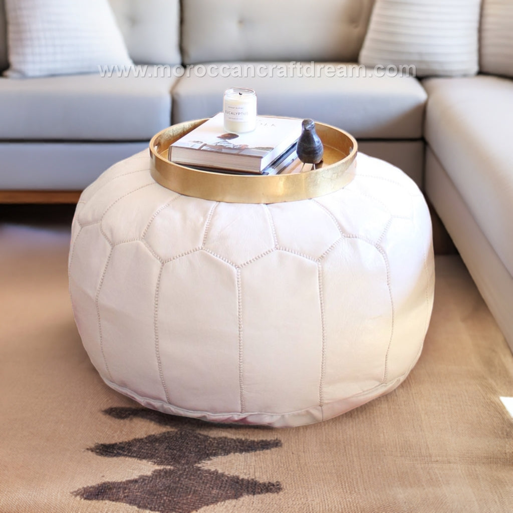 White pre-stuffed Versatile Moroccan leather pouf ottoman, suitable as additional seating, footrest, or stylish coffee table.