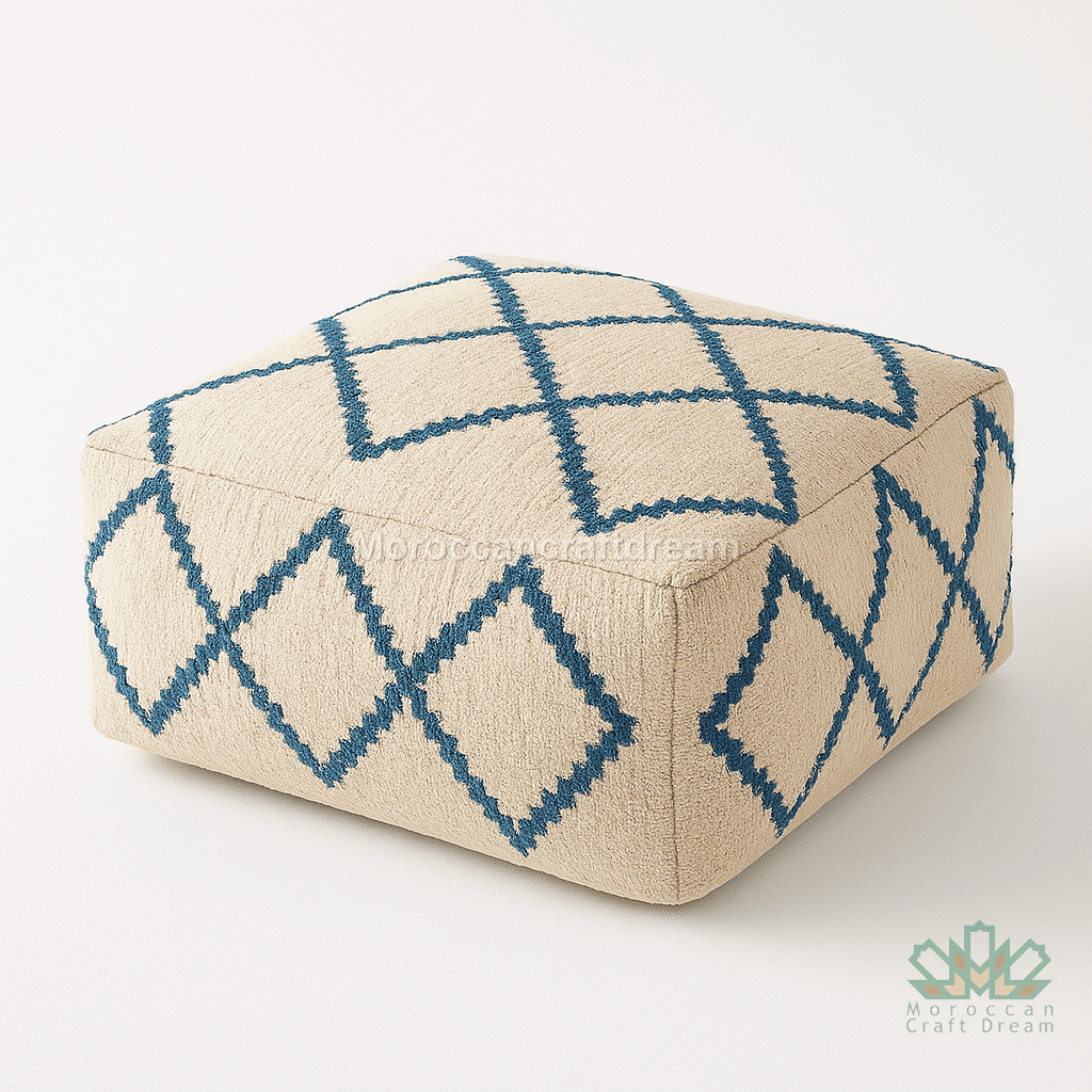 Beige ottoman with blue geometric pattern on a white background