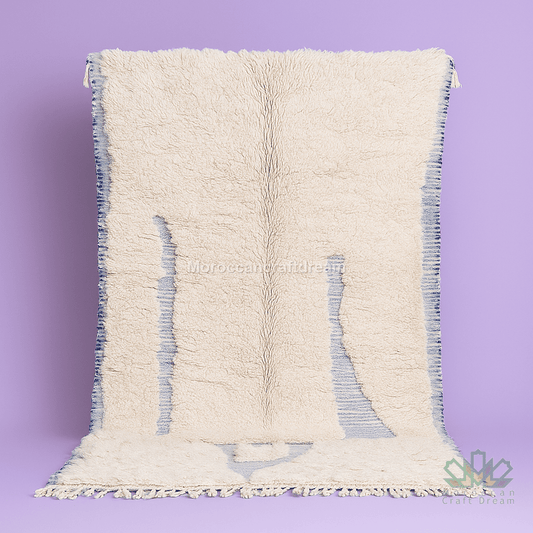 Textured white rug with blue accents on a purple background