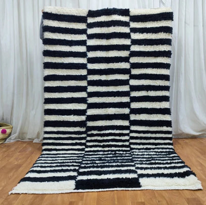 Berber area rugs and Moroccan carpets featuring traditional designs, handcrafted from high-quality materials for authentic home decor.