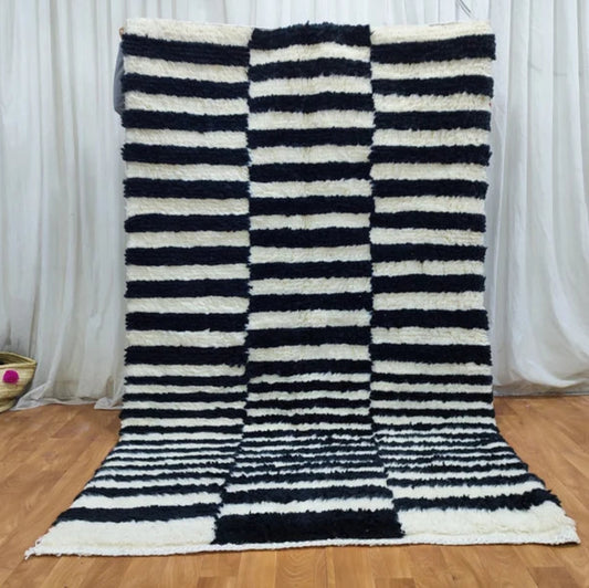 Berber area rugs and Moroccan carpets featuring traditional designs, handcrafted from high-quality materials for authentic home decor.