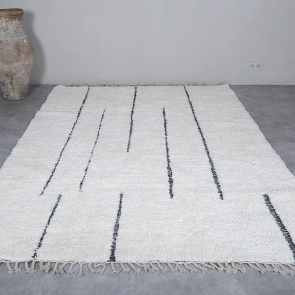 Berber area rugs and Moroccan carpets featuring traditional designs, handcrafted from high-quality materials for authentic home decor.