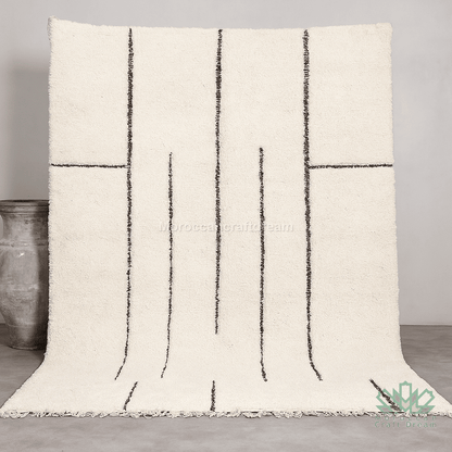 Textured throw blanket with black line pattern on a neutral background