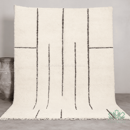 Textured throw blanket with black line pattern on a neutral background