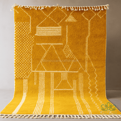 Yellow rug with geometric patterns on a plain background