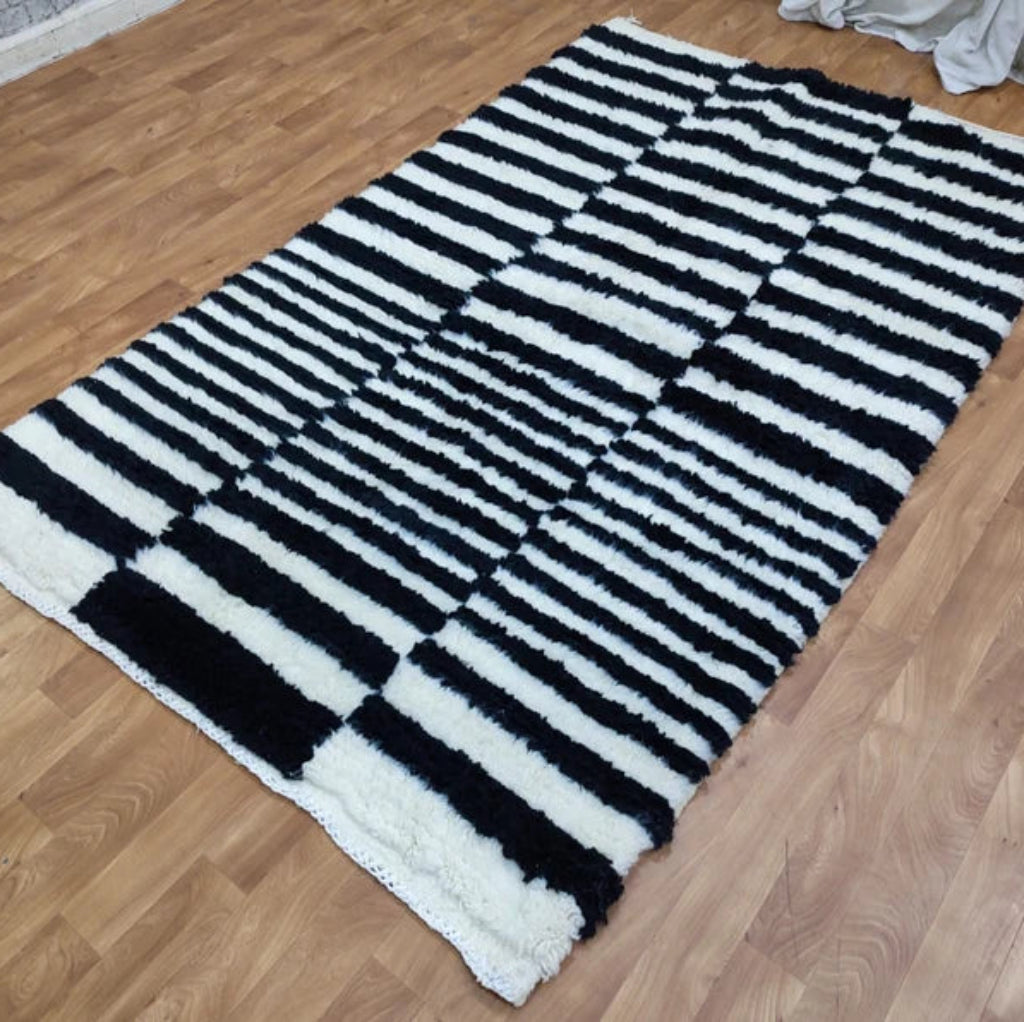 Berber area rugs and Moroccan carpets featuring traditional designs, handcrafted from high-quality materials for authentic home decor.