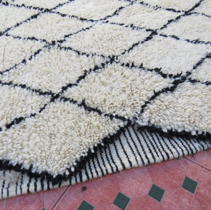 Berber area rugs and Moroccan carpets featuring traditional designs, handcrafted from high-quality materials for authentic home decor.