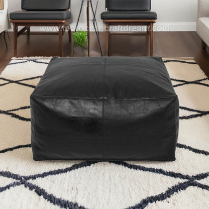 Large black Square leather coffee table ottoman, designed to enhance home decor with a unique and stylish presence.