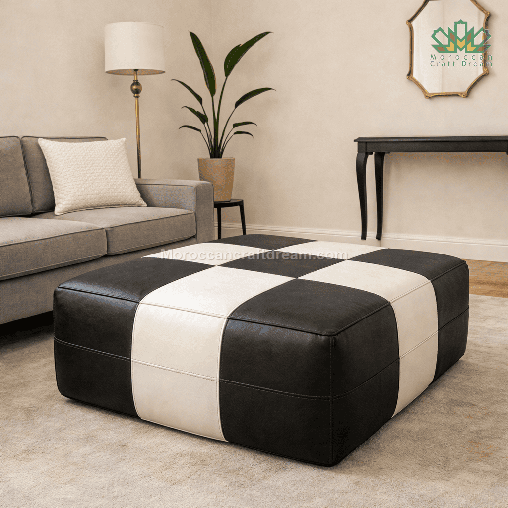 Black and white checkered ottoman in a living room setting with a gray sofa and lamp.