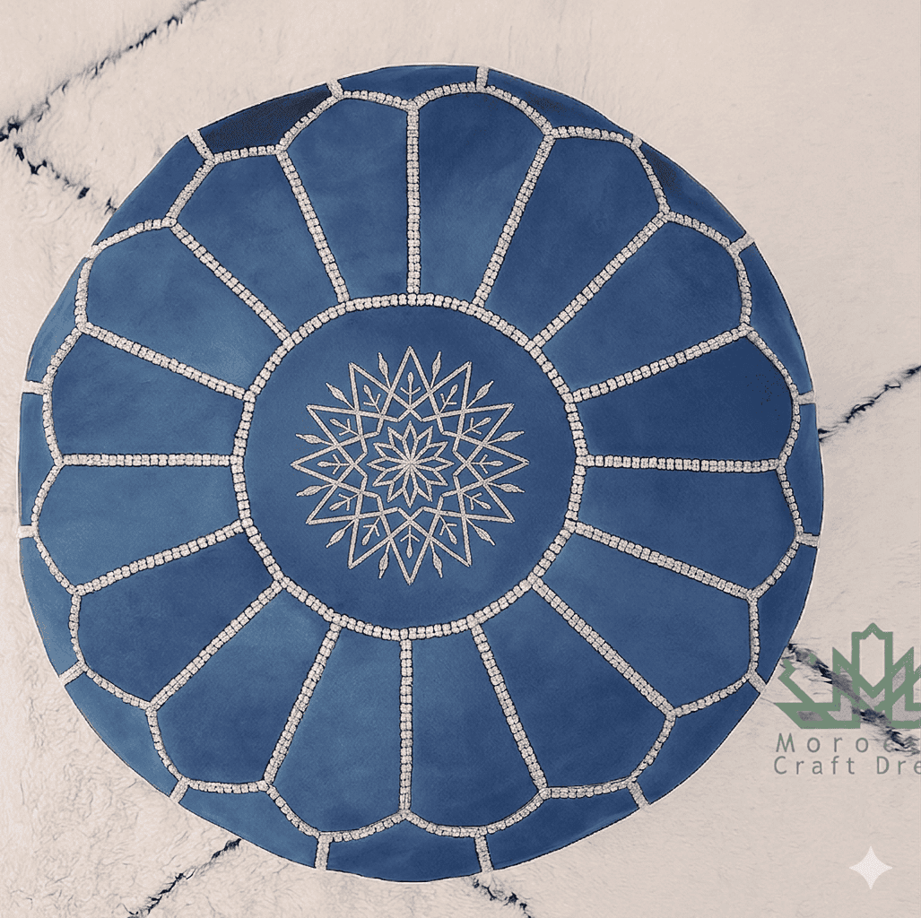 Blue circular rug with white geometric pattern on a textured surface