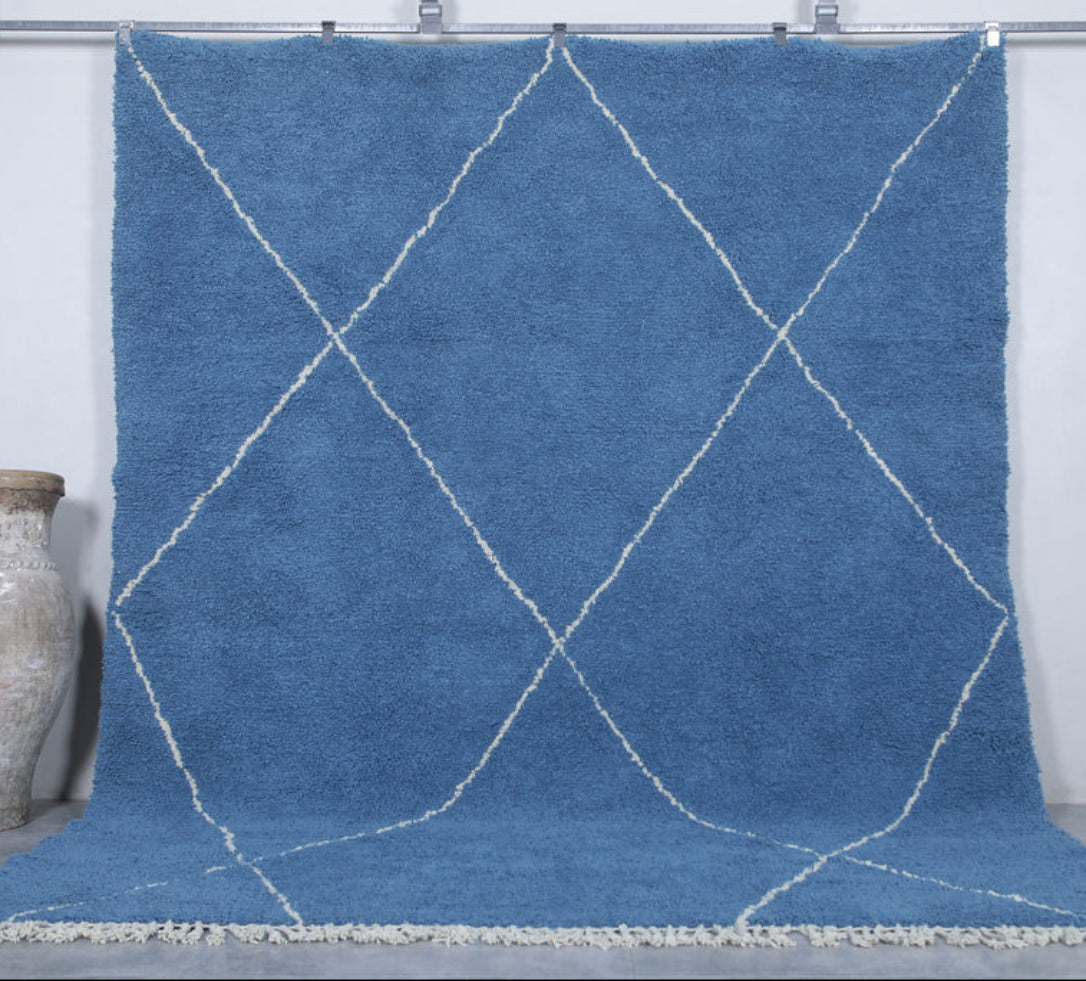 Berber area rugs and Moroccan carpets featuring traditional designs, handcrafted from high-quality materials for authentic home decor.