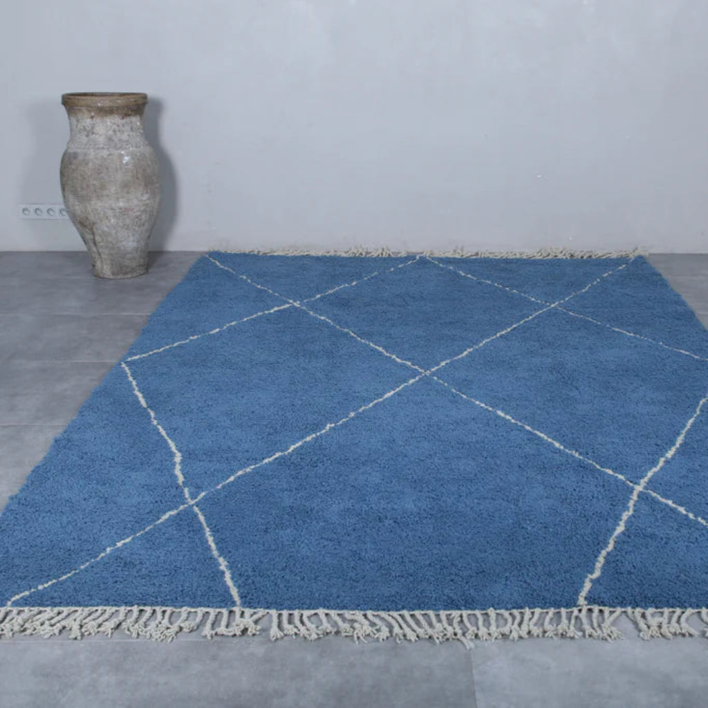 Blue berber area rugs and Moroccan carpets featuring traditional designs, handcrafted from high-quality materials for authentic home decor.