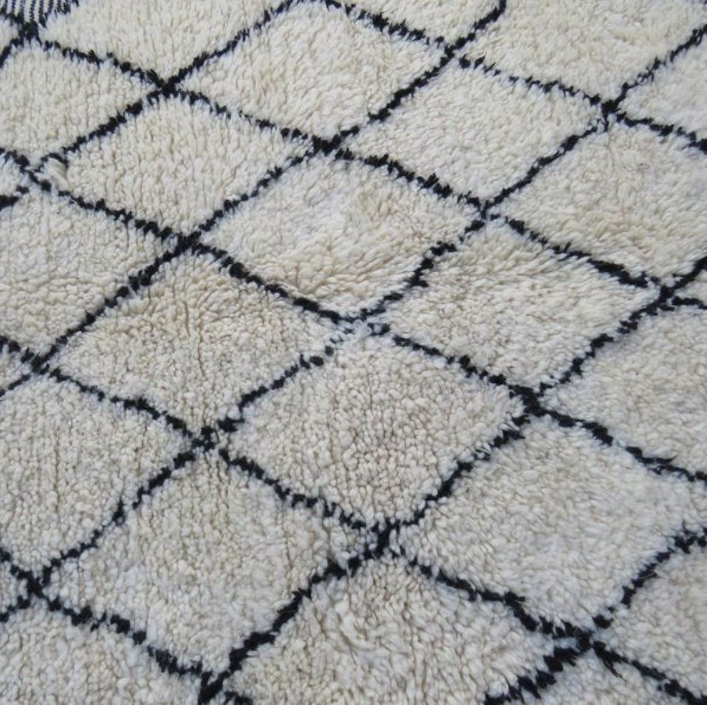 Berber area rugs and Moroccan carpets featuring traditional designs, handcrafted from high-quality materials for authentic home decor.