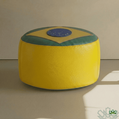 Round ottoman with a design resembling the Brazilian flag on a neutral background