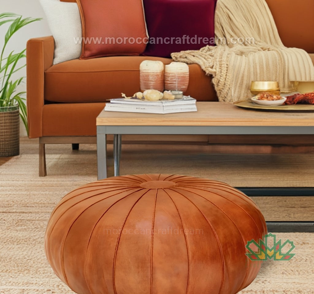 Caramel Round Moroccan pouf used as a coffee table, handmade with durable materials and traditional stitching in natural tones.