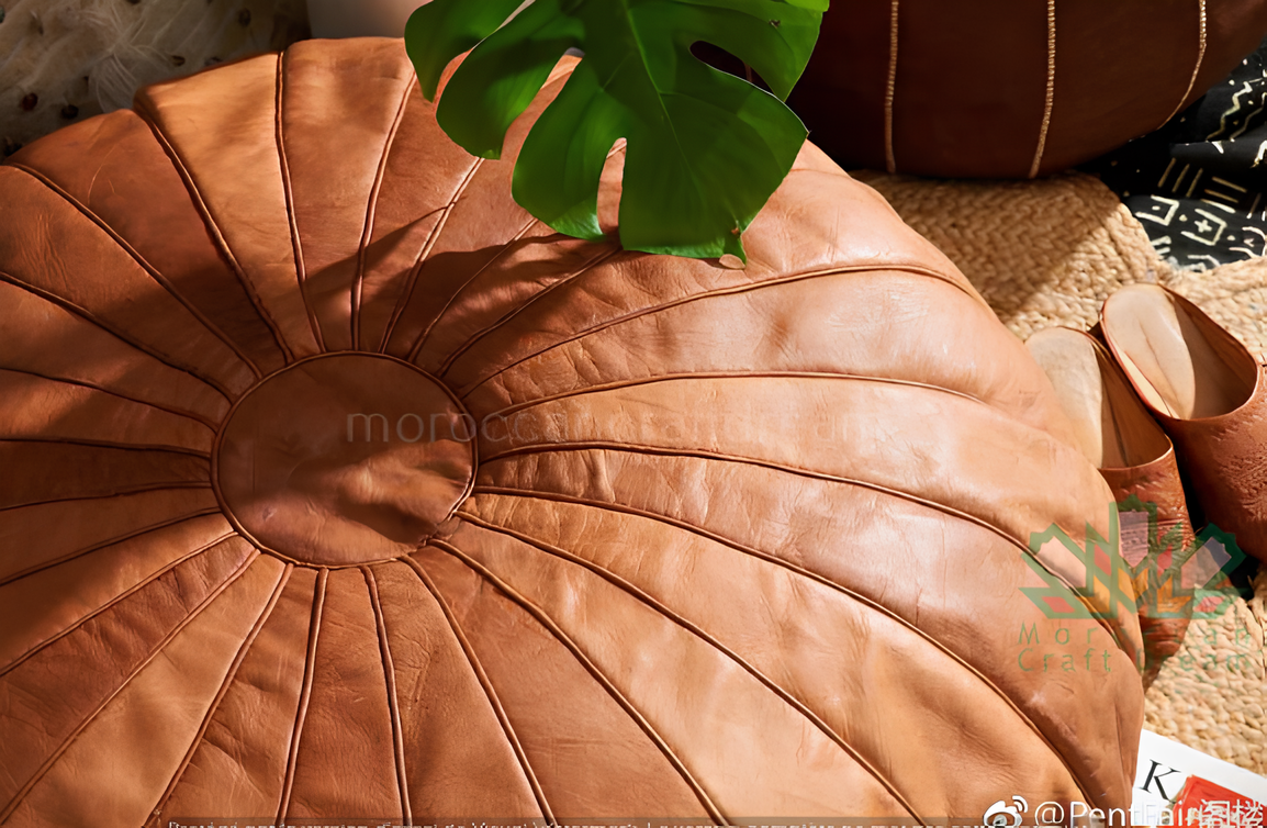 Caramel Round Authentic Moroccan leather pouf ottoman, handcrafted for use as a coffee table or footrest in any home decor.