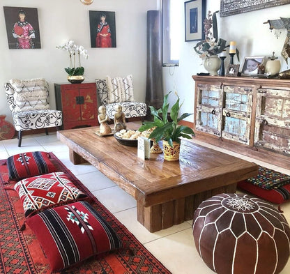 Chocolate Brown Moroccan leather ottoman used as a coffee table, combining style and versatility for elegant home settings.