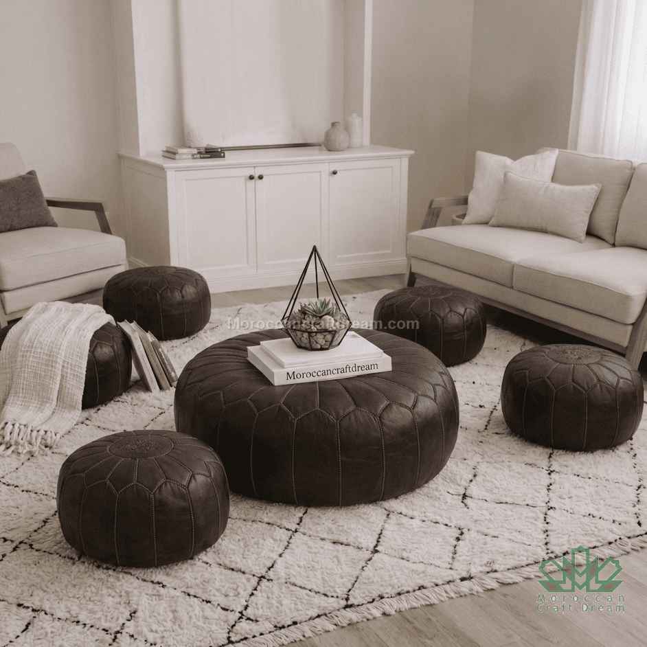 Living room with brown leather ottomans, beige sofa, and white rug.