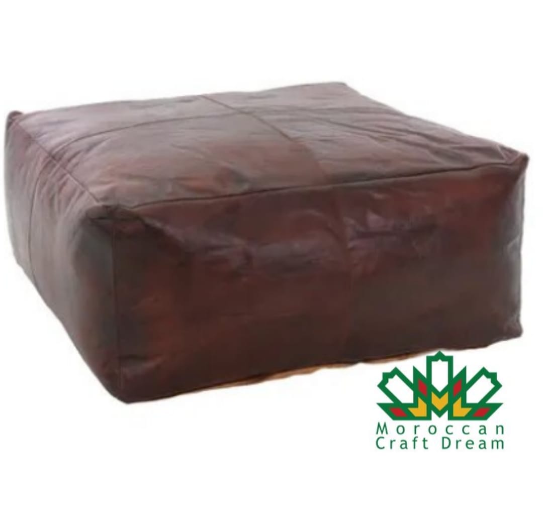 Chocolate brown Artisan square leather coffee table ottoman, handcrafted with premium leather for a luxurious decor addition.