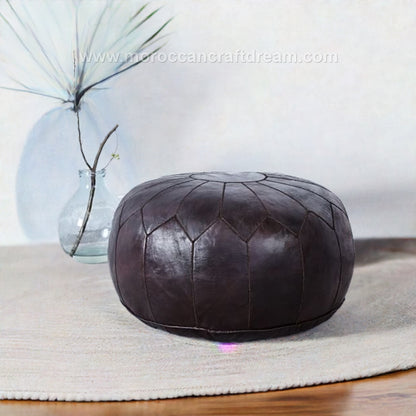 Moroccancraftdream brown chocolate leather pouf ottoman with geometric patterns, offering versatile use as a seat, footrest, or coffee table.