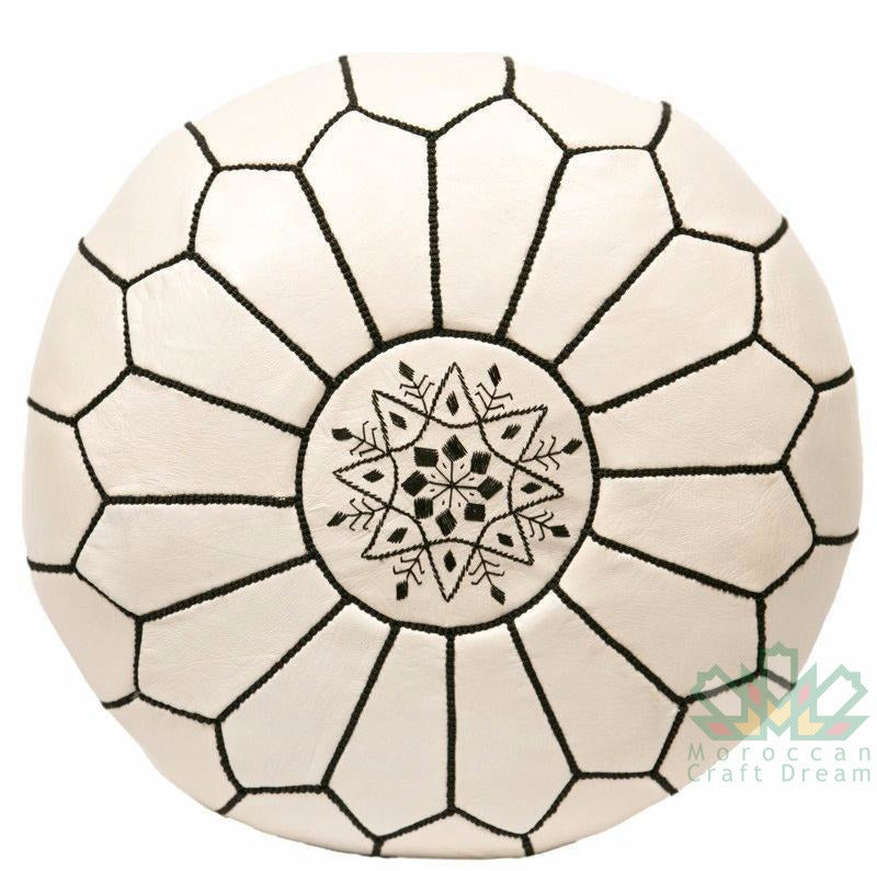 cream beige Handmade round Moroccan pouf ottoman in genuine leather, perfect for use as a versatile coffee table or footrest. This Moroccan leather ottoman enhances living room decor with its elegant design and multifunctional use. Crafted from high-quality leather, Moroccancraftdream's leather poufs offer a stylish and practical solution for modern living spaces. Ideal for use as a coffee table or seating, this round pouf adds a touch of sophistication to any room