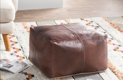 Large Brown and chocolate leather ottoman coffee table, perfect for modern living room decor, blending Moroccan pouf ottoman design with functionality. Ideal as an extra large ottoman coffee table, seamlessly fitting into furniture coffee table sets, adding style and practicality to any space.