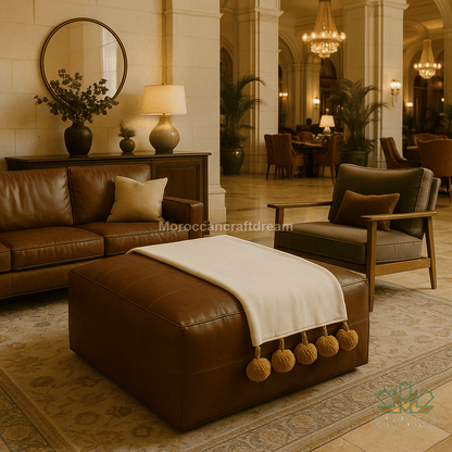 Luxurious living room with brown leather furniture and decorative elements.