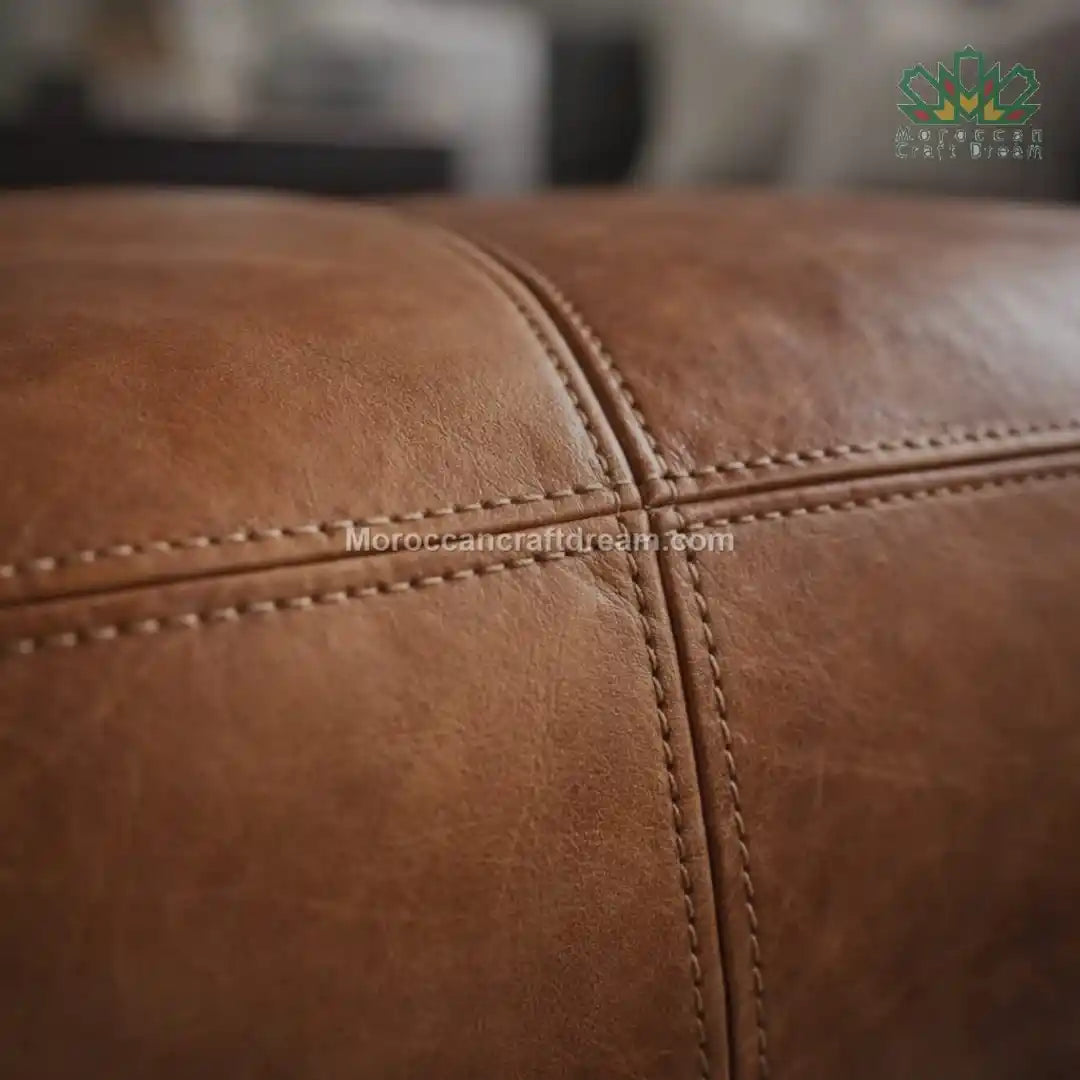 Close-up of brown leather texture with visible stitching