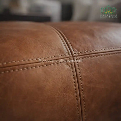 Close-up of brown leather texture with visible stitching