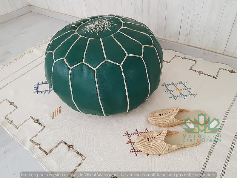 Handmade Green Moroccan leather pouf, perfect for use as a coffee table or versatile seating option.