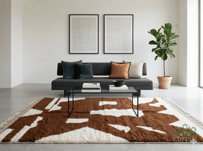 Modern living room with a patterned rug, sofa, and coffee table.