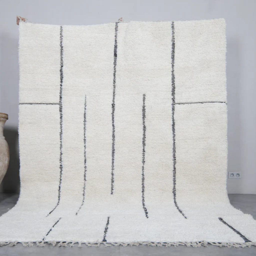 Berber area rugs and Moroccan carpets featuring traditional designs, handcrafted from high-quality materials for authentic home decor.