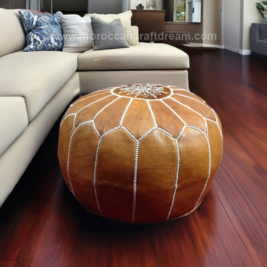 Elegant and functional Moroccan leather pouf ottoman in a classic design, suitable for modern and traditional interiors.