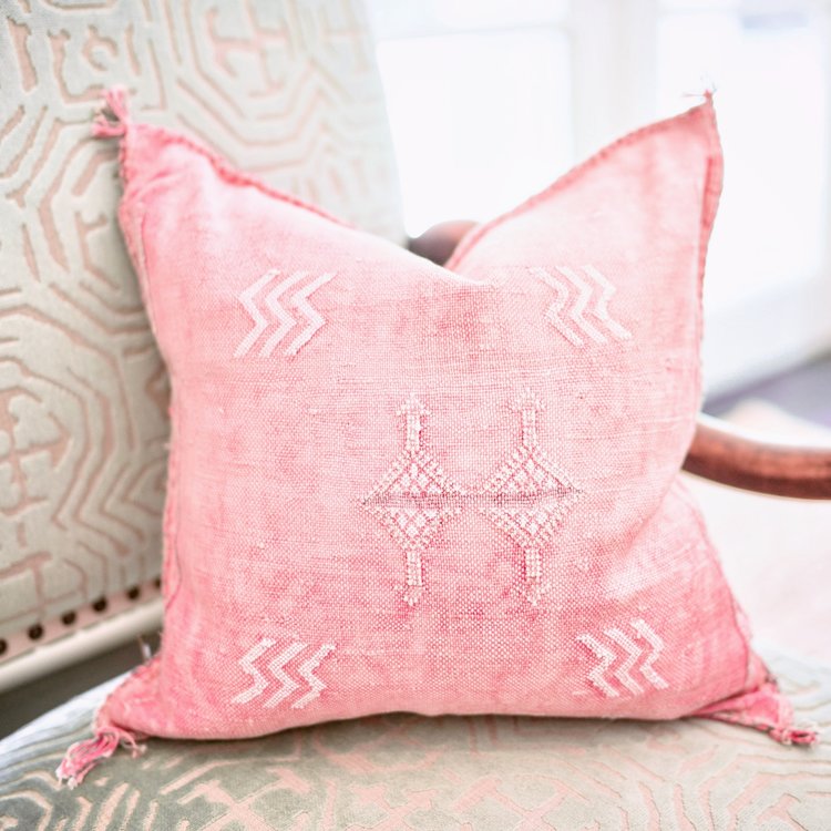 Close-up of Moroccan hand-loomed cactus silk pillow with vibrant colors