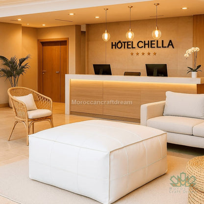 Hotel lobby with reception desk, chairs, and decor elements.
