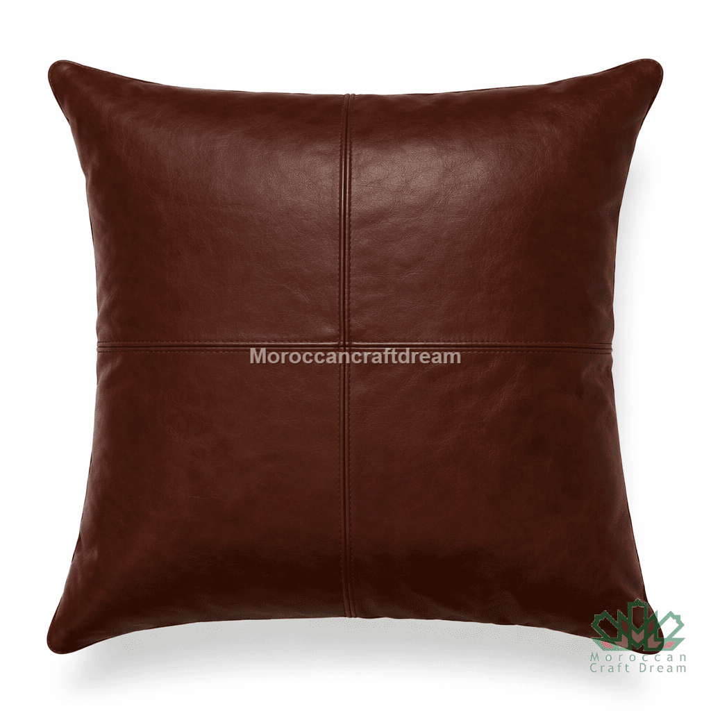 Brown leather pillow with 'MoroccanCraftDream' branding on a white background