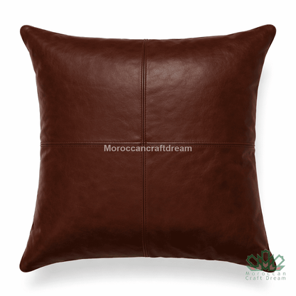 Brown leather pillow with 'MoroccanCraftDream' branding on a white background