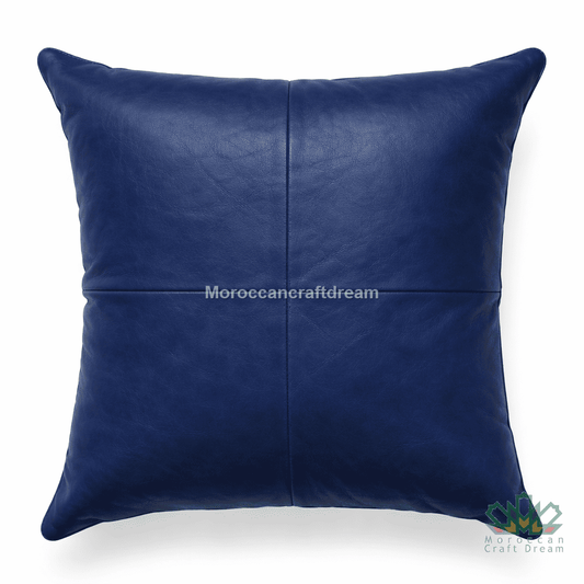 Navy Blue leather pillow on a white background with 'MoroccanCraftDream' branding.