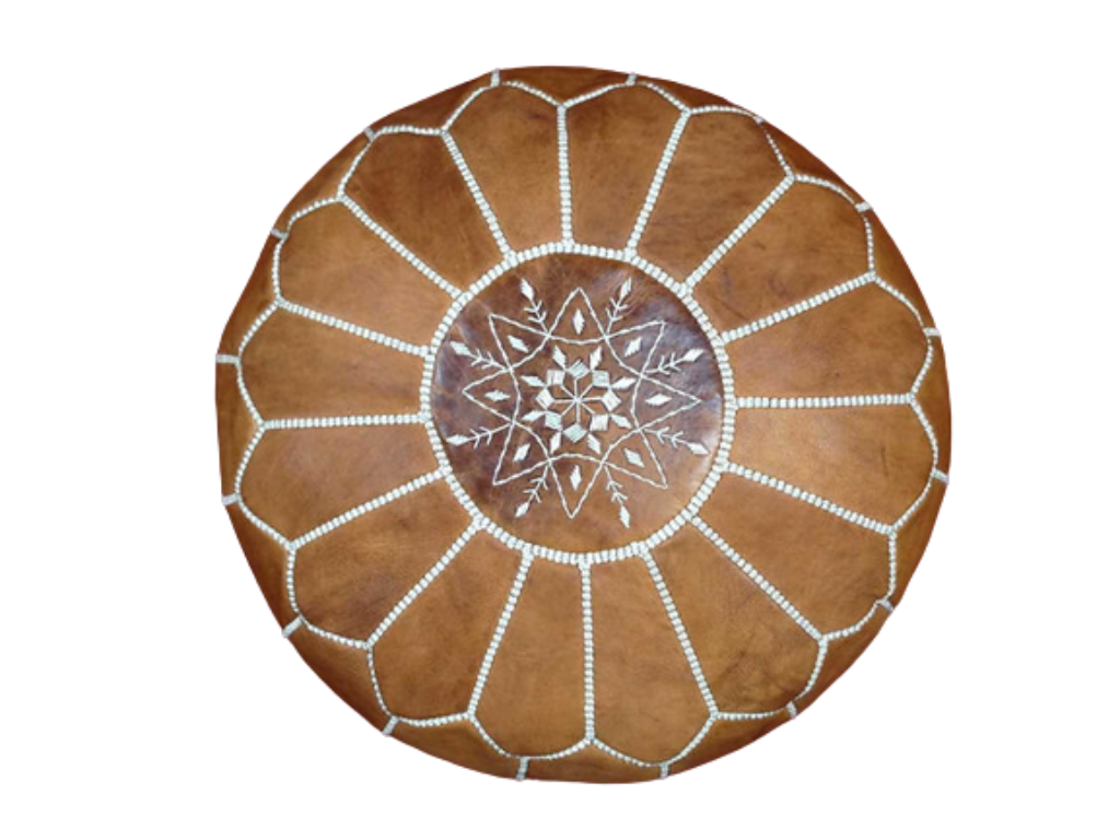 Handmade light caramel Moroccan leather pouf with intricate geometric designs, perfect for enhancing living room style