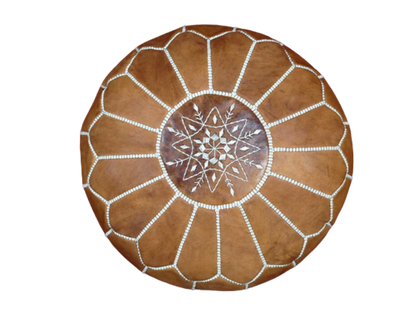 Handmade light caramel Moroccan leather pouf with intricate geometric designs, perfect for enhancing living room style