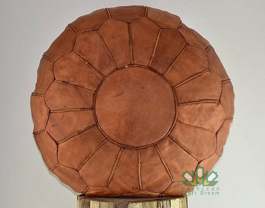 Light caramel Moroccan leather pouf ottoman by Moroccancraftdream qwithout star patern, ideal for living room or bedroom decor.