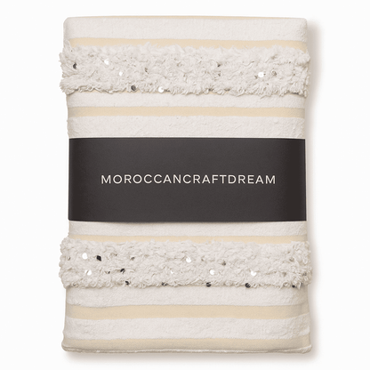 Decorative towel with textured border and 'Moroccancraftdream' label on a white background