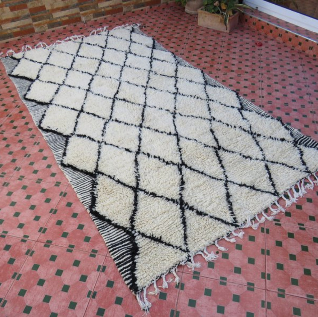 Berber area rugs and Moroccan carpets featuring traditional designs, handcrafted from high-quality materials for authentic home decor.