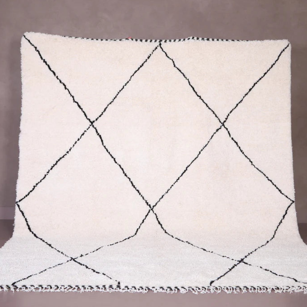 Berber area rugs and Moroccan carpets featuring traditional designs, handcrafted from high-quality materials for authentic home decor.