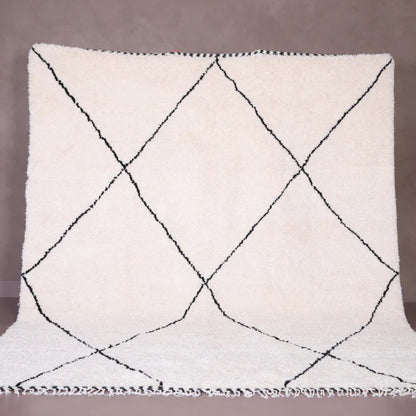 Berber area rugs and Moroccan carpets featuring traditional designs, handcrafted from high-quality materials for authentic home decor.